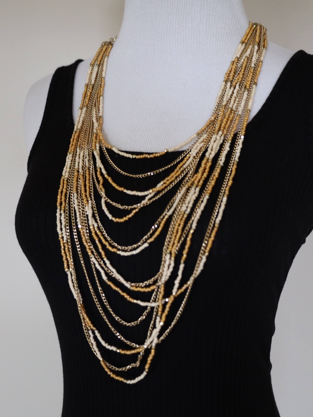 Multi-Strand Gold and Cream Beaded Statement Necklace